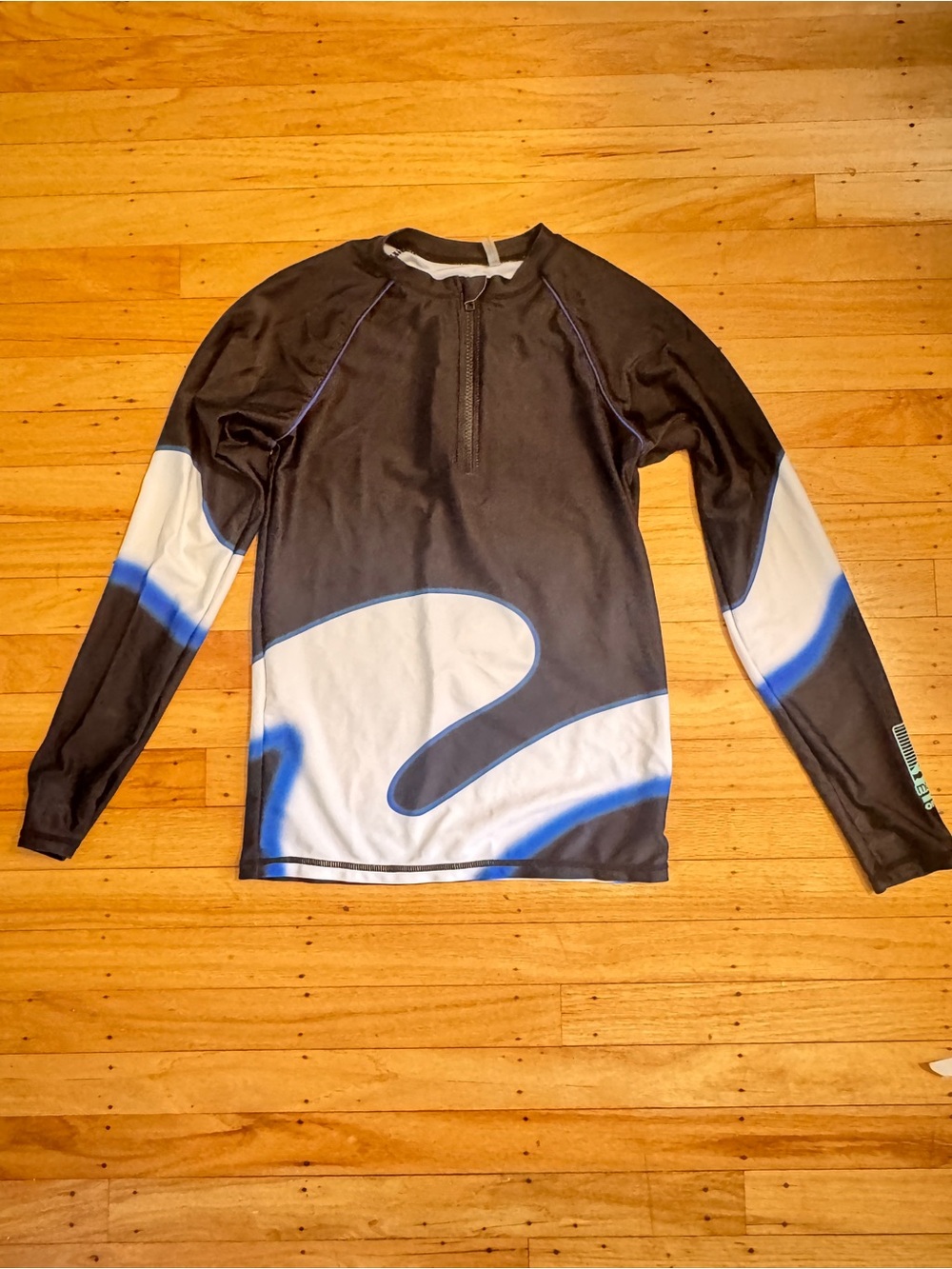 Sharp looking Molo Long Sleeve Rash Guard - Black, White & Blue